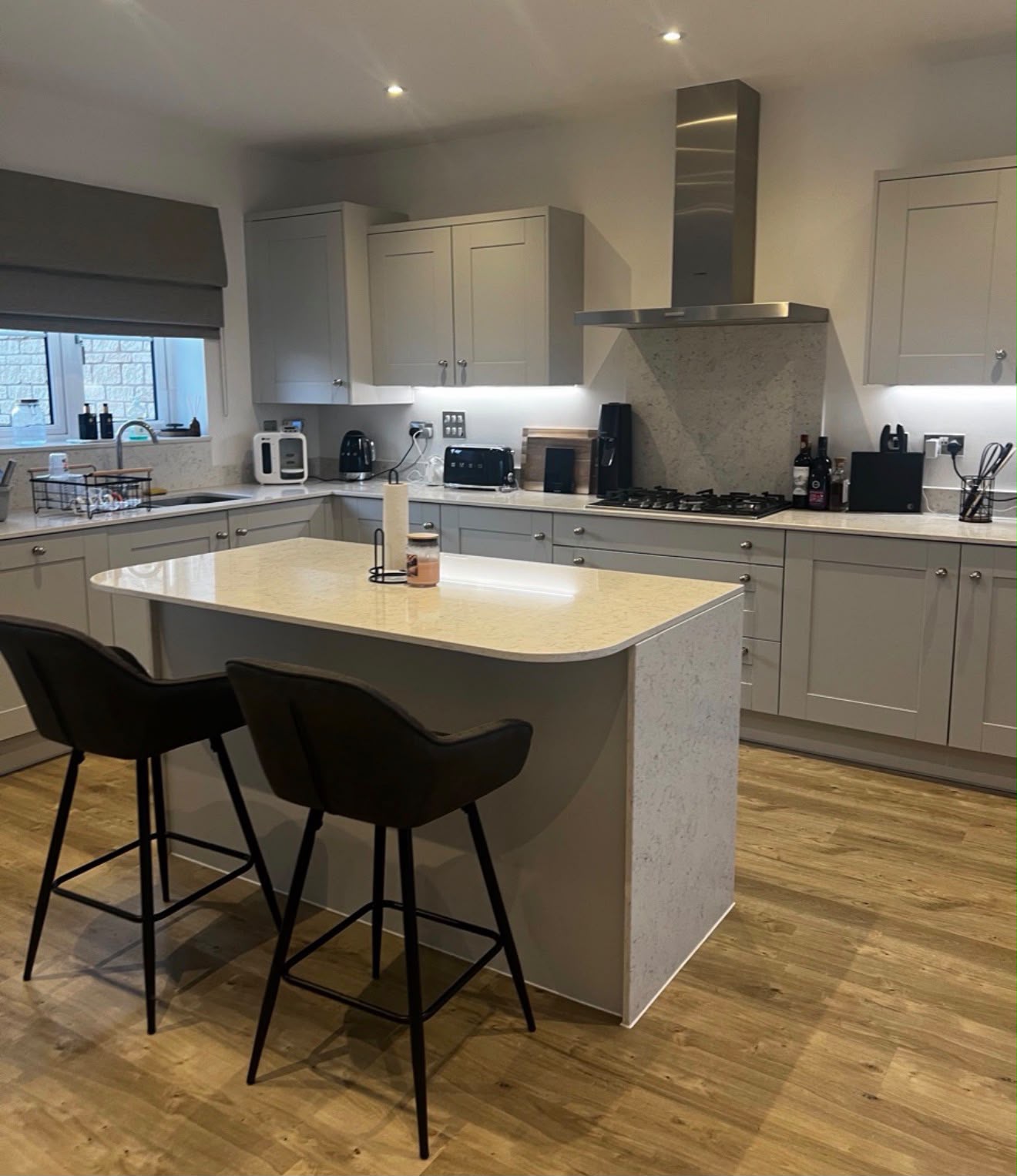Finished kitchen with clean countertops and island