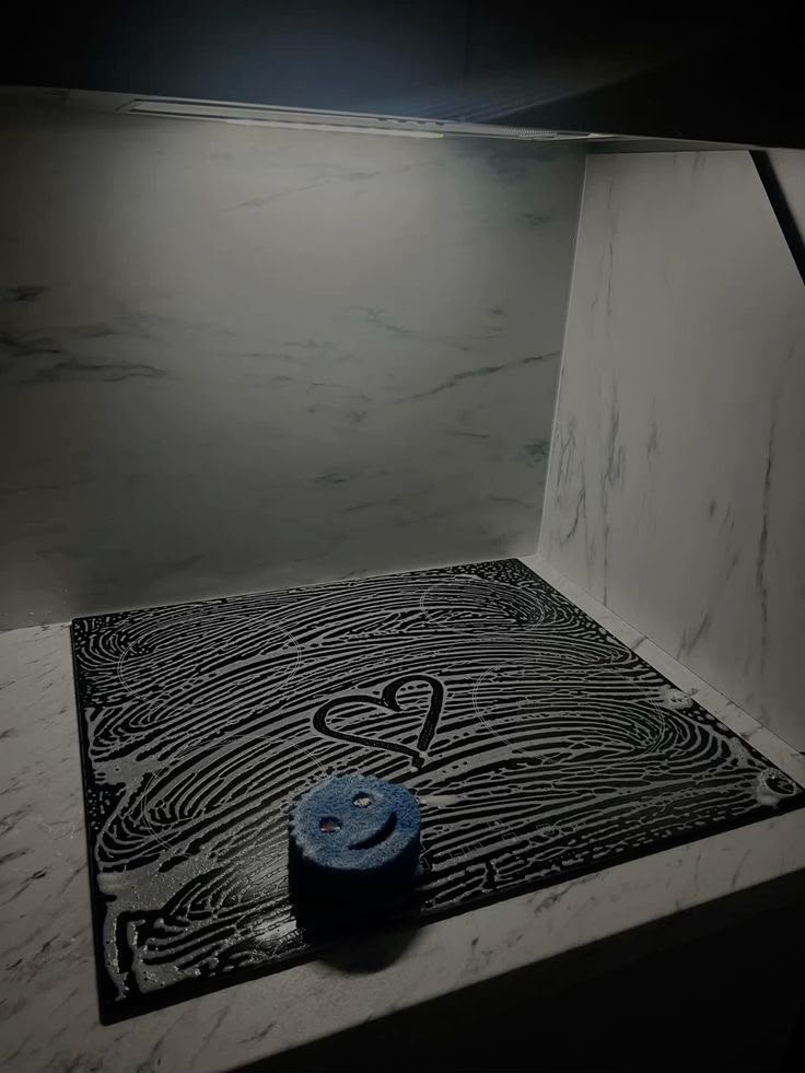Freshly cleaned shower with a heart drawn in the suds